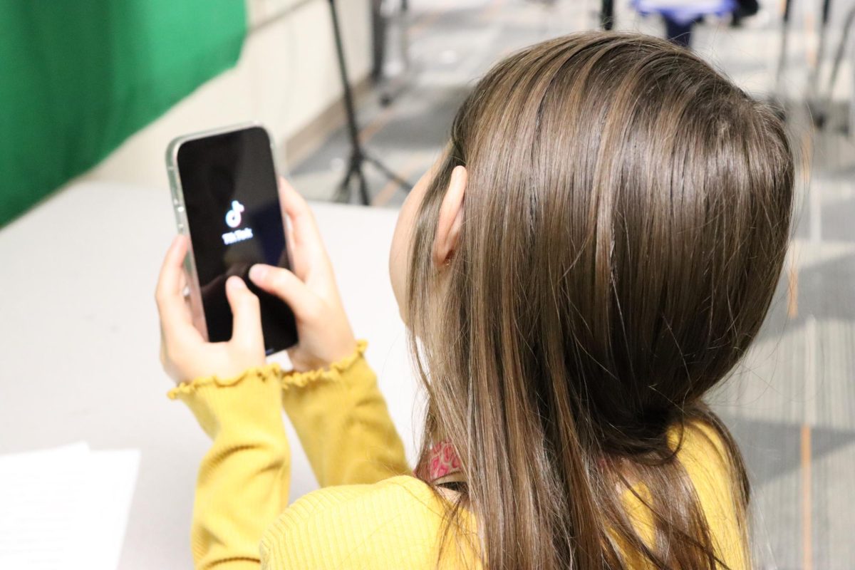 7th grader Halyn Annibal uses TikTok on her phone.