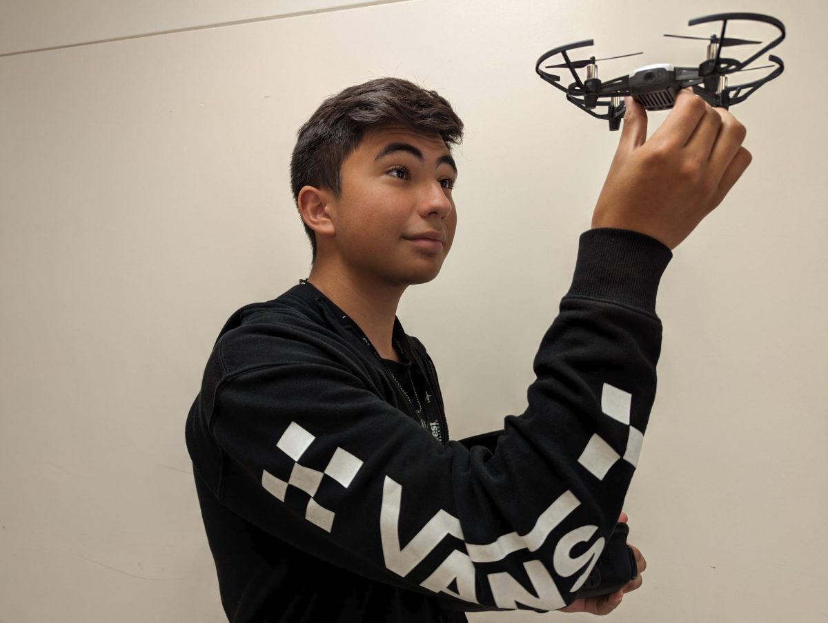 Jaxon Giles holds one of the drones that is available at Century Middle School.