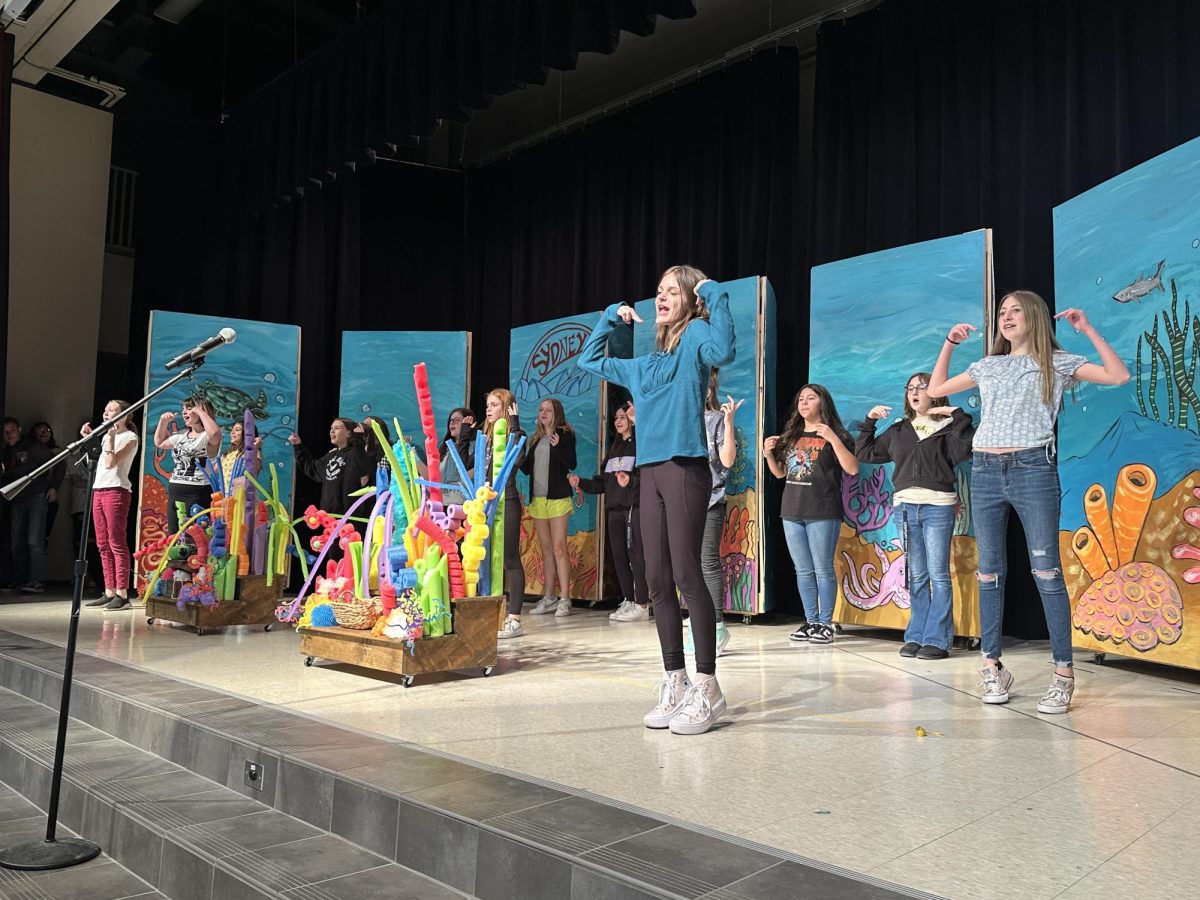 Cast rehearse the musical after school.