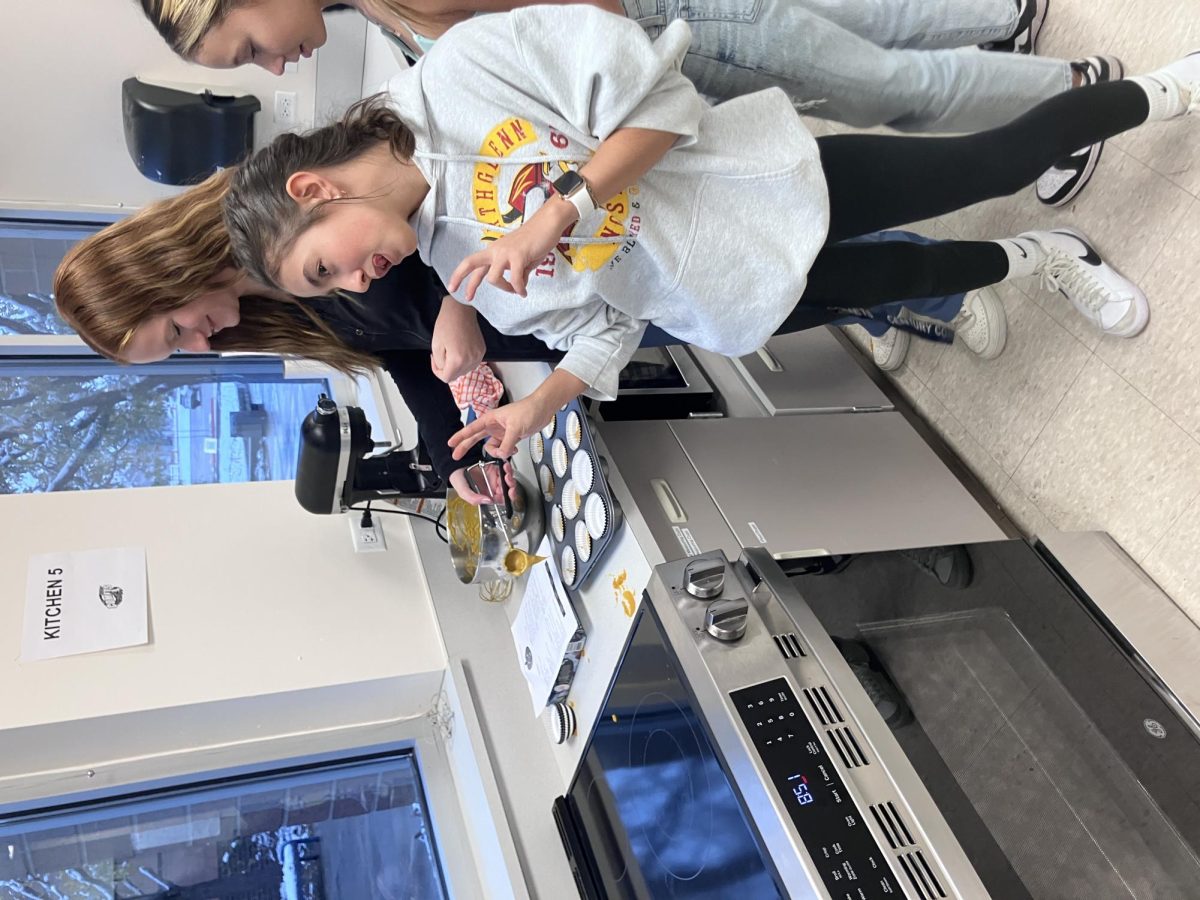 Avery, Lucy and Abby make cupcakes during an FCCLA meeting.