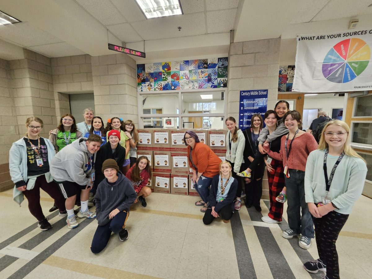 NJHS & STUCCO kids stand by their packaged boxes.