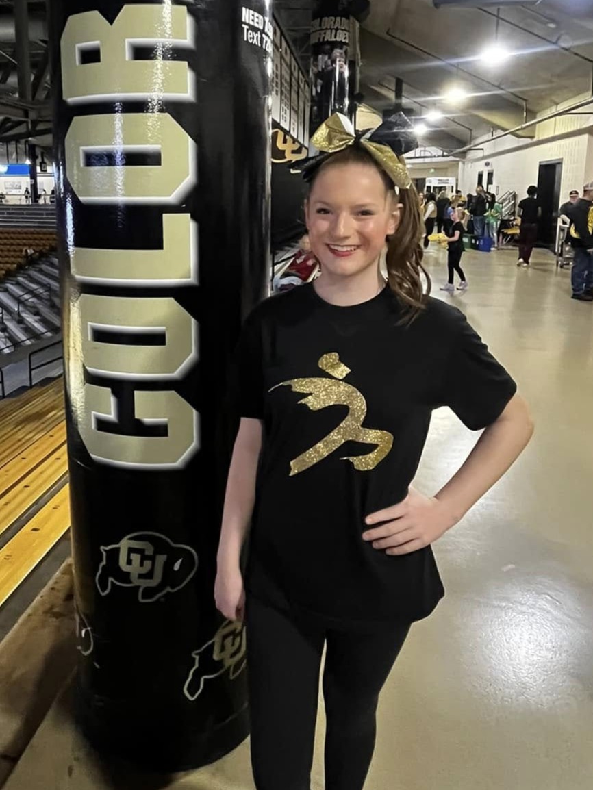 Avery Klautsch performs at a CU Women's basketball game in February 2025.