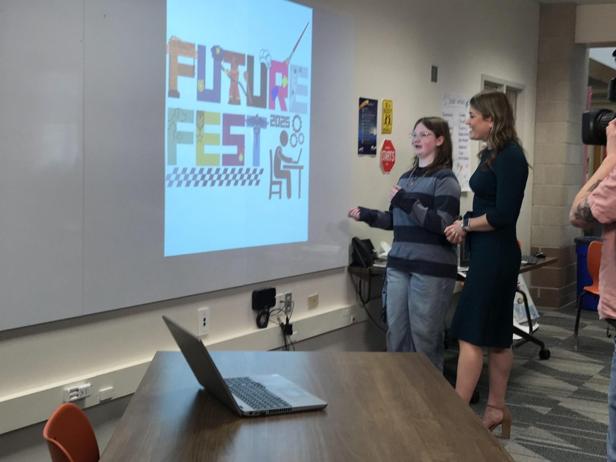 Anna showing Kelly her Future Fest design.